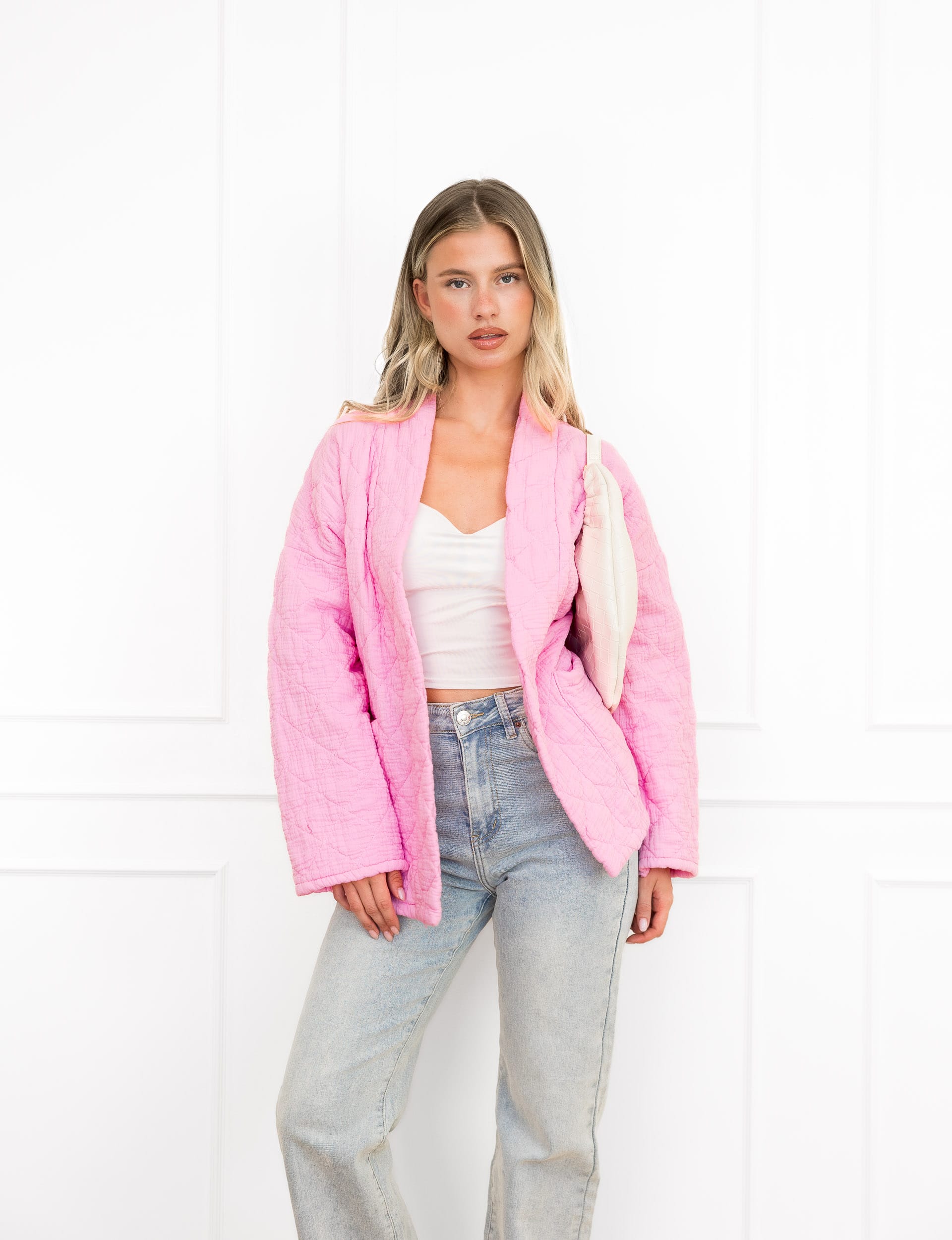 Megan jasje roze met motief en steekzakken.