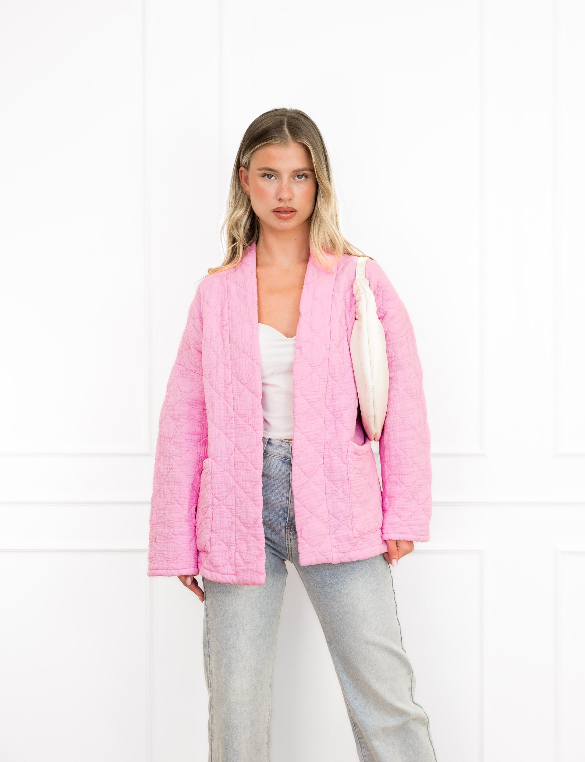 Megan jasje roze met motief en steekzakken.