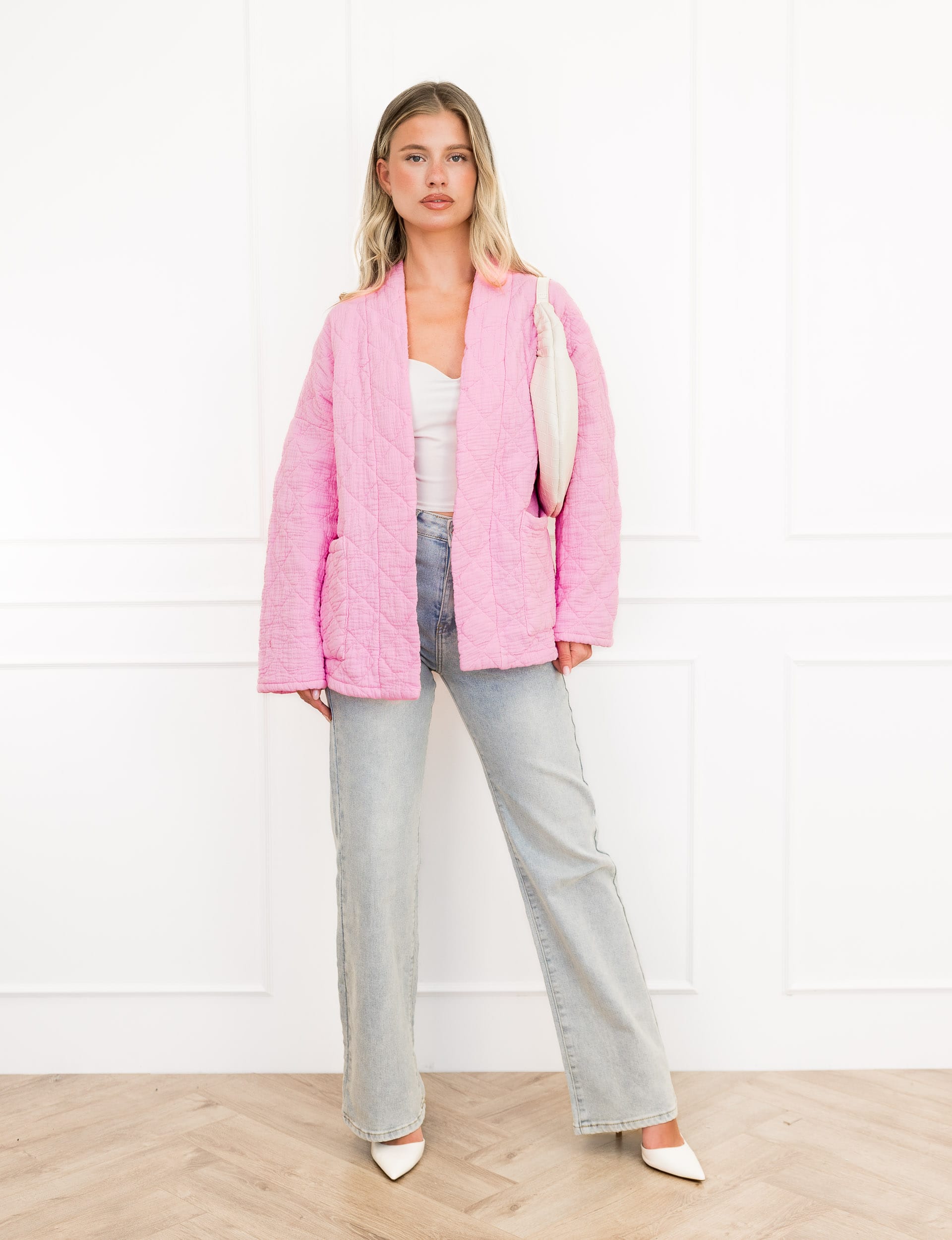 Megan jasje roze met motief en steekzakken.