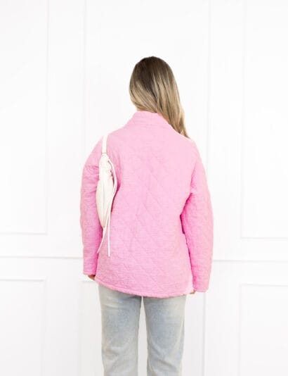 Megan jasje roze met motief en steekzakken.