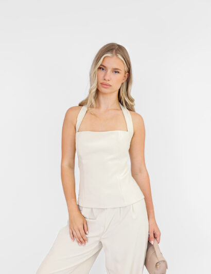 Dames haltertop met aangesloten pasvorm en zijsrits, gecombineerd met bijpassende pantalon